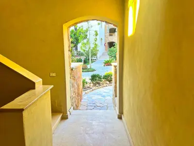 an entrance to a house with an archway at Azzura appartment sahl hashesh with private garden in Hurghada