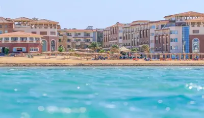 a view of a beach with buildings and the ocean at Royal Beach G 05 in Hurghada