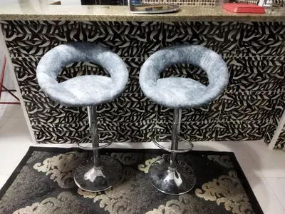 a couple of stools sitting in front of a counter at Hurghada City Apartment1 in Hurghada
