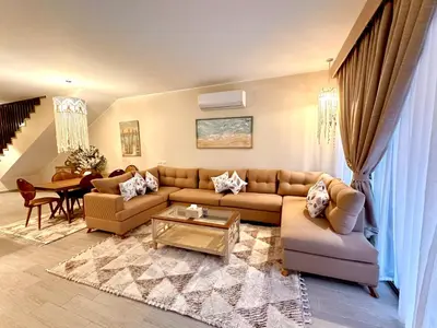 a living room with a couch and a table at Luxury Villa Bali Al Gouna Hurgh in Hurghada
