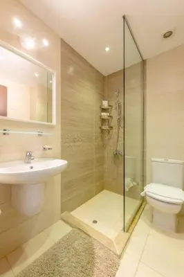 a bathroom with a toilet and a sink and a shower at Gcribs apartment pool view in El Gouna
