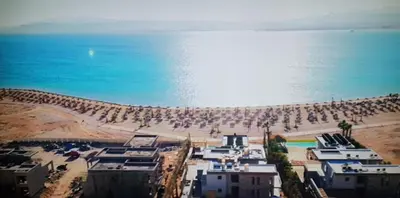 a view of a beach with a lot of people at Exceptional Apartment in Soma Bay 4pax in Hurghada