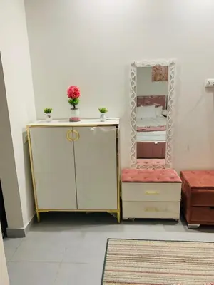 a room with a vanity with a mirror and a dresser at Scandic beach resort in Hurghada
