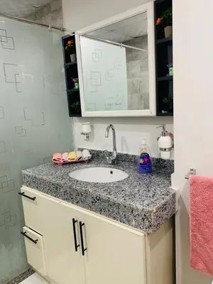 a bathroom counter with a sink and a pink towel at Scandic beach resort in Hurghada