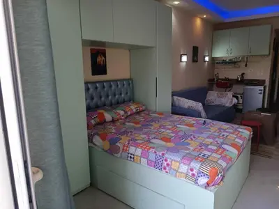 a small bedroom with a bed in a room at Harmony Sunny Chalet With Wi-Fi in Hurghada