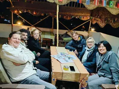 a group of people sitting around a box at Dream Garden Luxor in Luxor