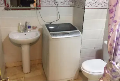 a small bathroom with a sink and a toilet at FeWo Port Ghalib in Port Ghalib