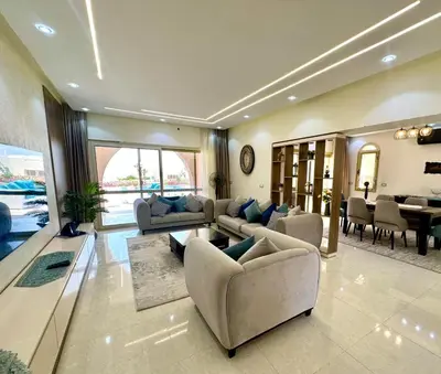 a large living room with couches and a dining room at The view compound in Hurghada