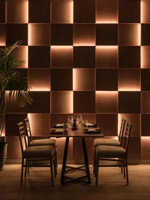 a dining room with a table and two chairs at JAZ Elite Asteria in Hurghada