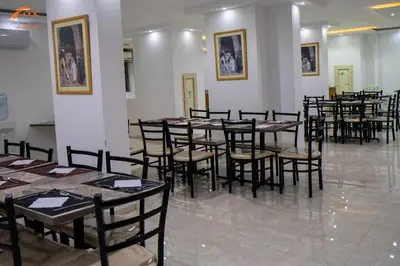a group of tables and chairs in a room at Fox Resort El Gouna in Hurghada
