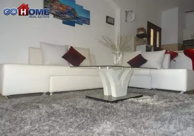 a living room with a white couch and a table at Apartment -Y97-0-8- 1 BR Sabina in Hurghada