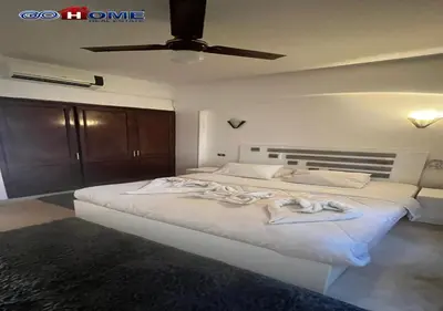 a bedroom with a large white bed with a ceiling at Apartment -Y97-0-8- 1 BR Sabina in Hurghada