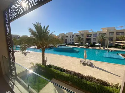 a view of a swimming pool from a balcony at Stunning 2 BR/ Free Beach & Pool Access @ Mangroovy, El Gouna in Hurghada