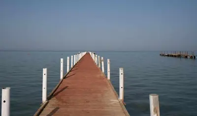 a wooden pier stretches out into the water at Fox House Beach Resort & Spa El Gouna in Hurghada