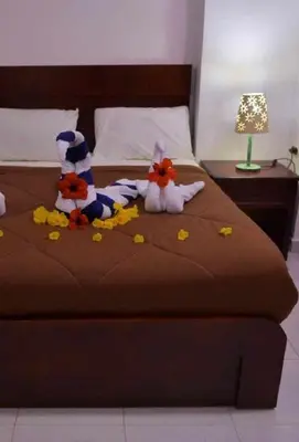 two stuffed animals on top of a bed at Fox House Beach Resort & Spa El Gouna in Hurghada