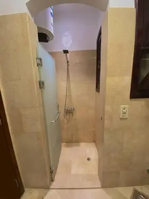 a bathroom with a shower and a walk in shower at Magical 2BR Ground/Free Pool & Lagoon Access @ElGouna in Hurghada