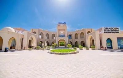 a large building with a courtyard in front of it at Makadi heights luxury apartment in Hurghada