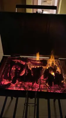 a grill with some food on top of it at Makadi heights luxury apartment in Hurghada