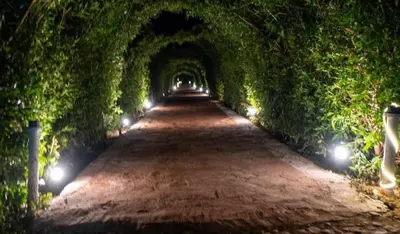 a tunnel with lights on the sides of a road at Fox Resort El Gouna Stay in Hurghada