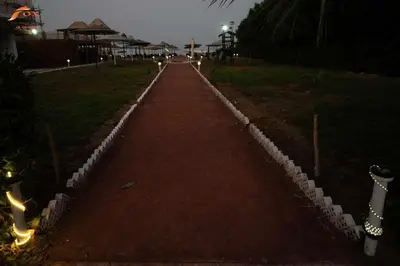 a walkway in a park at night at Fox Resort El Gouna Stay in Hurghada