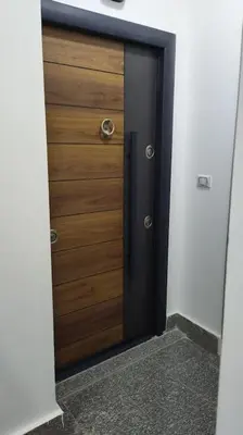 a large wooden door in a room with a hallway at Condo with Breathtaking 's view with 2 bedrooms in Hurghada