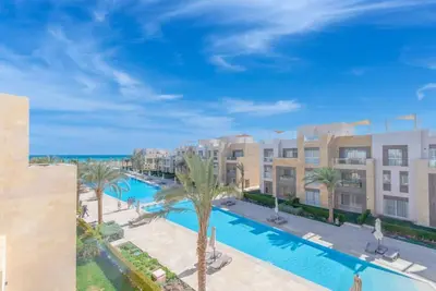 an image of a swimming pool at a resort at Beach-Inspired 1BR in Mangroovy, El Gouna. Sea & Pool in Hurghada