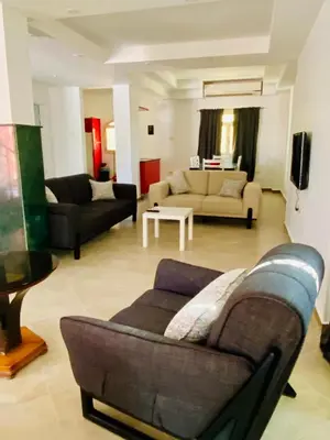 a living room with two couches and a couch at villa 5 in magawish in Hurghada