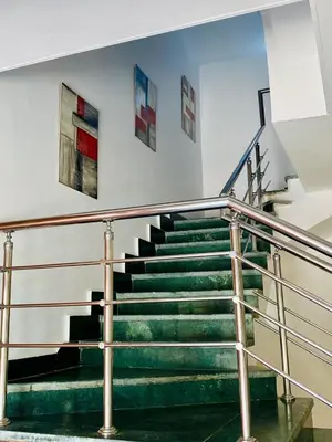 a staircase in a building with green steps at villa 5 in magawish in Hurghada