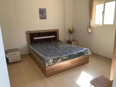 a bedroom with a bed with tin foil on it at Alfayrouz house in Hurghada