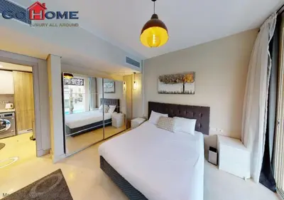 a bedroom with a large white bed and a window at Stylish 1BR @ Mangroovy-M7-6B in Hurghada