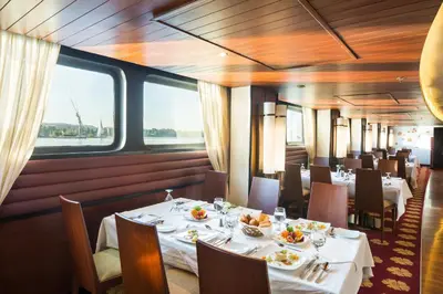 a dining car of a train with tables and chairs at M/Y ALYSSA - 4 or 7 Nights From Luxor each Monday and 3 or 7 Nights From Aswan each Friday in Luxor