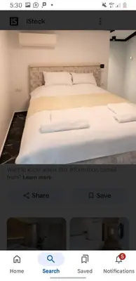 a screenshot of a bedroom with a bed in a room at Sheraton Plaza Near Marina in Hurghada