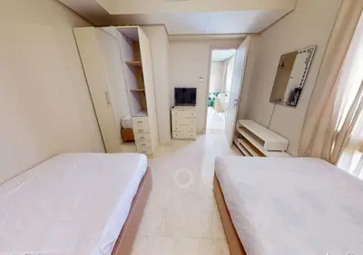 a white room with two beds and a mirror at Beautiful 2 Bed Rooms at Mangaroveey M7-4B-El-Gouna in Hurghada