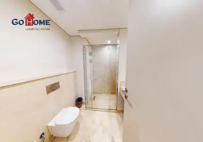 a bathroom with a toilet and a shower at Beautiful 2 Bed Rooms at Mangaroveey M7-4B-El-Gouna in Hurghada