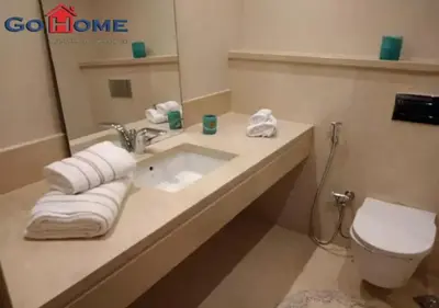 a bathroom with a sink and a toilet at Warm 1BR with @ Mangroovy, El-Gouna M1-7B in Hurghada