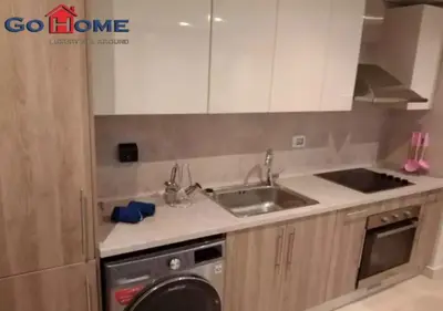 a kitchen with a sink and a washing machine at Warm 1BR with @ Mangroovy, El-Gouna M1-7B in Hurghada