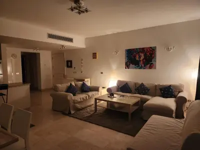 a living room with couches and a coffee table at Elgouna - Directly To The Marina in Hurghada