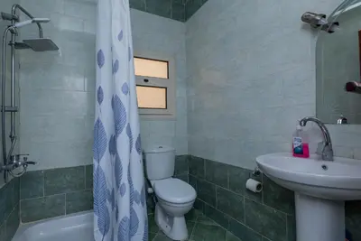 a bathroom with a toilet and a sink at La BONITA FLAT in Hurghada