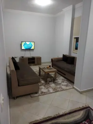 a living room with a couch and a table at Hurghada city Apartment 4 in Hurghada