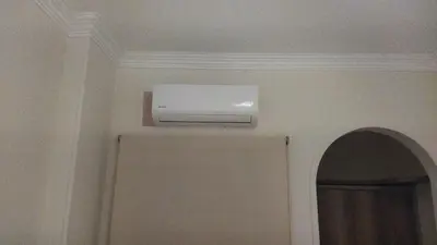 a room with a air conditioner on the ceiling at Hurghada city Apartment 4 in Hurghada