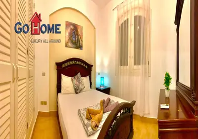 a bedroom with a bed with a teddy bear on it at Friendly 1 Bed Room Y12 -0 West Golf at El-Gouna in Hurghada
