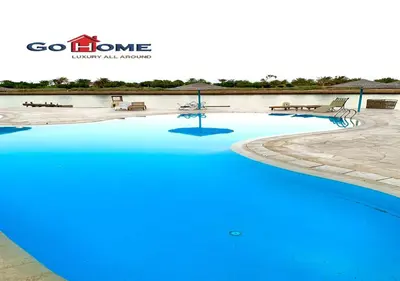 a swimming pool with blue water in a resort at Friendly 1 Bed Room Y12 -0 West Golf at El-Gouna in Hurghada