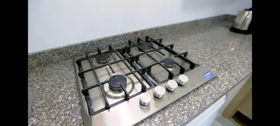 a stove top oven sitting on top of a counter at La bonita studio b1 in Hurghada