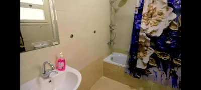 a bathroom with a sink and a shower curtain at La bonita studio b1 in Hurghada