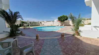 a swimming pool in the middle of a yard at La bonita studio b1 in Hurghada