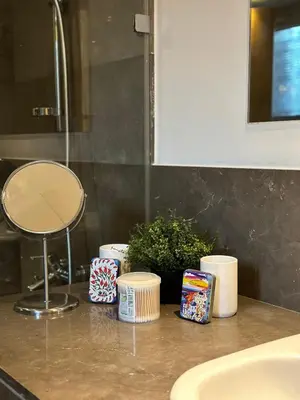 a bathroom counter with a sink and a mirror at Bright & Lovely 2 Beds Apartment in Scarab Club, El Gouna in Hurghada