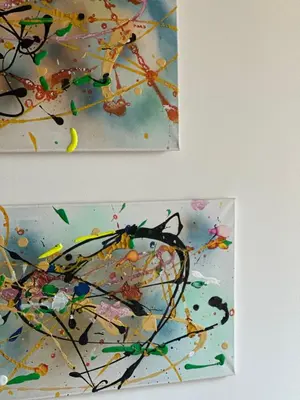 two pictures of a painting with paint on a wall at Bright & Lovely 2 Beds Apartment in Scarab Club, El Gouna in Hurghada