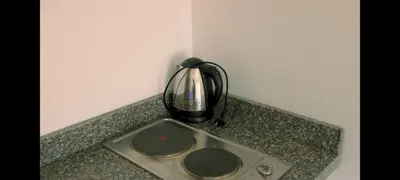 a tea kettle sitting on top of a counter at La bonita studio in Hurghada