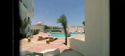 a view of a swimming pool from a building at La bonita studio in Hurghada