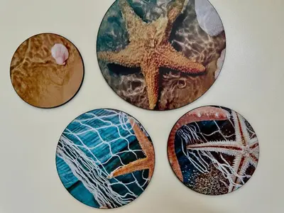 four plates with different pictures on a wall at Divers Home Safaga in Safaga